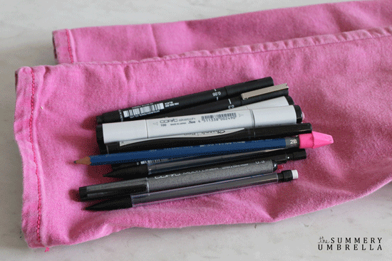 Handmade craft pouch for organizing pens, pencils, and markers.